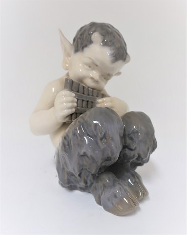 Royal Copenhagen. Faun with flute. Model 1736. Height 14 cm. (1 quality)