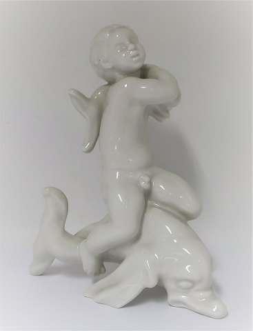 Bing & Grondahl. Porcelain figure. Kai Nielsen. Sea child on dolphin, blanc de 
chine. Height 20 cm. (1 quality)