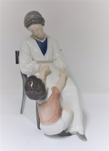 Royal Copenhagen. Porcelain figure. Mother and child. Model 413. Height 22 cm. 
(1 quality)