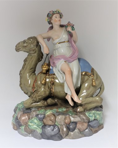 Royal Copenhagen. Porcelain figure. Woman on dromedary. From the series "The 
four continents" Asia. Model 12110. Height 32 cm. (1 quality)